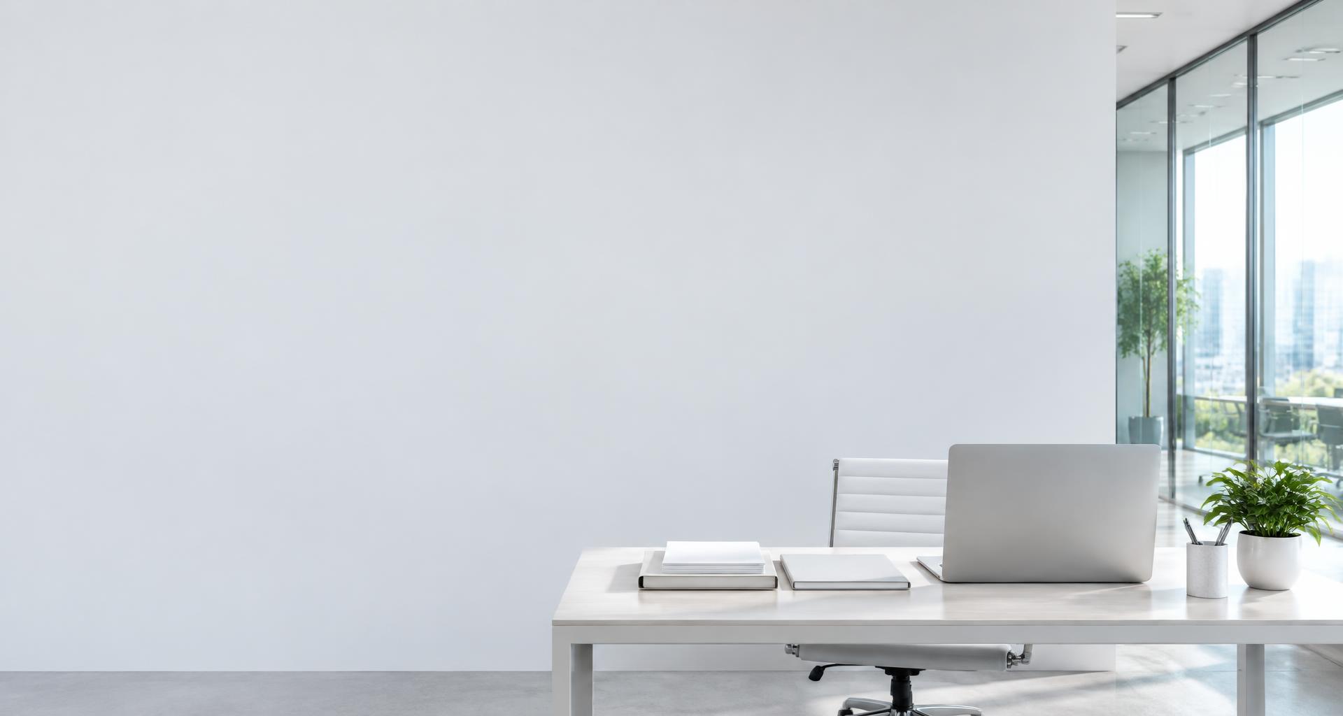 A bright office desk with organized documents and a laptop